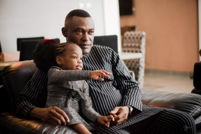 Father and child in the living room.