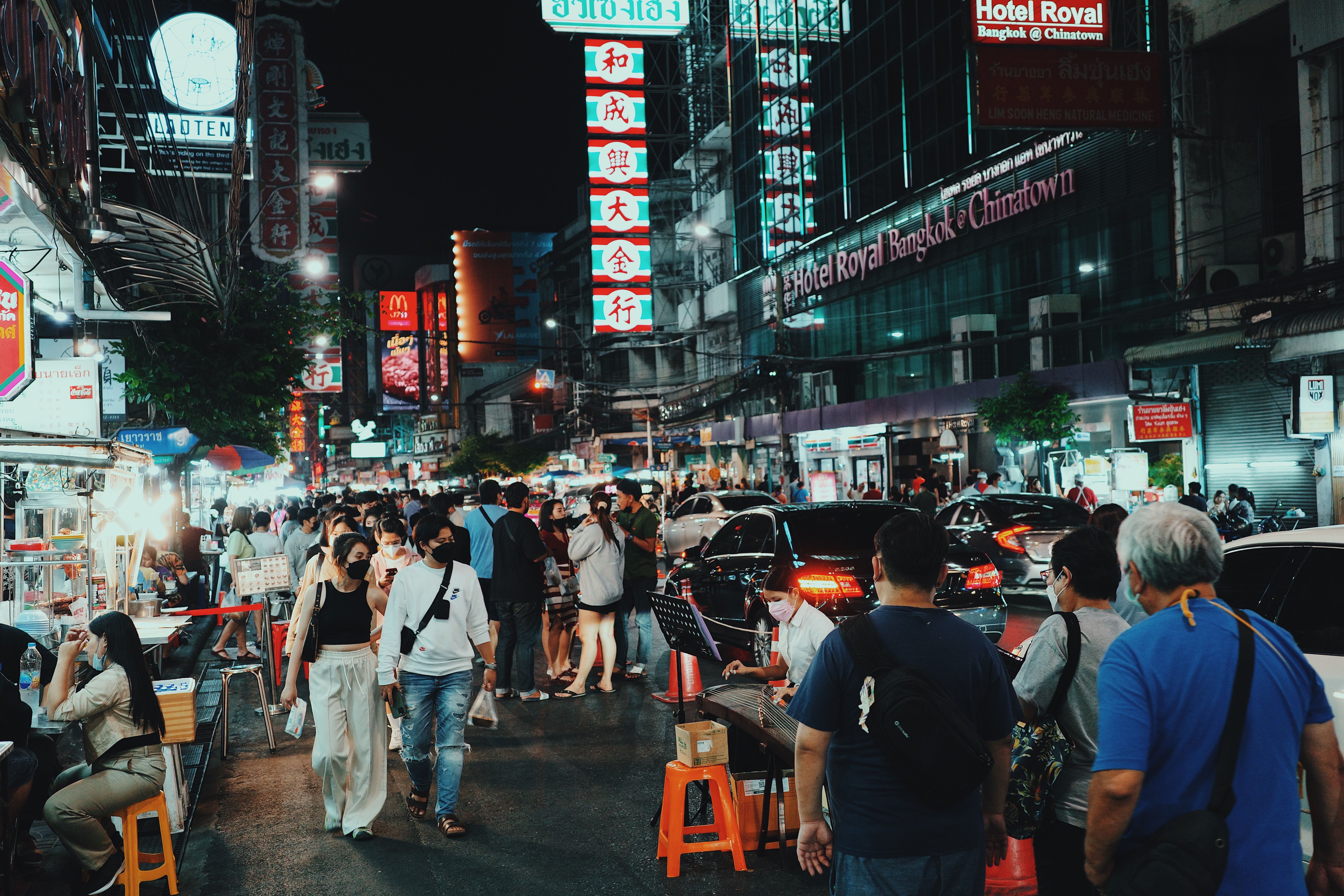 Bangkok Chinatown at night with neon signs, street food, and bustling late-night activity.