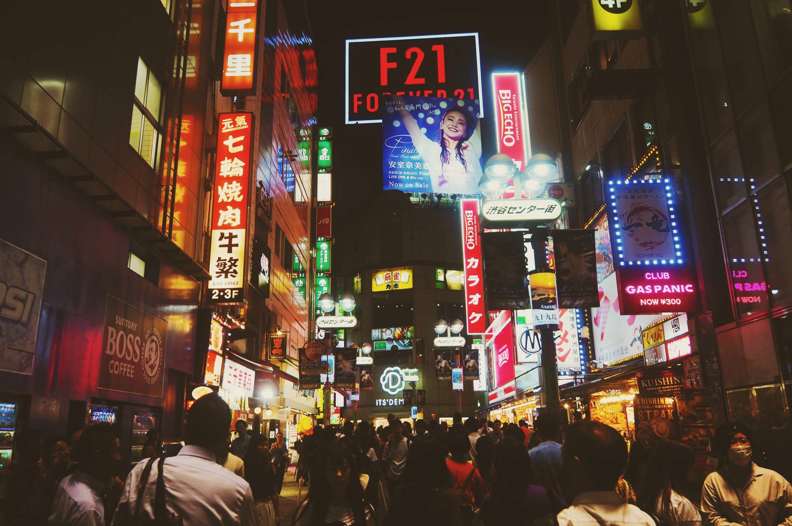 Best Cities Around the World for Nightlife in 2027 Tokyo nightlife street glowing with colorful billboards and crowds in a vibrant shopping district.